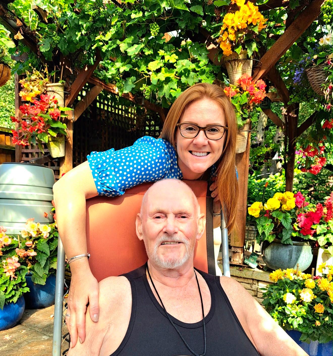 Gemma with a client in a sunlit garden
